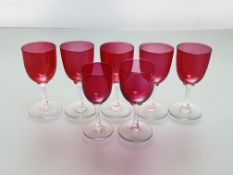 A matched set of seven cranberry glass wines. (7) Tallest 13.5cm