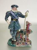 An early 19th century Staffordshire pearlware figure, possibly a theatrical figure, of a man in