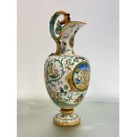 A large Cantagalli maiolica ewer, late 19th century, in the Deruta style, painted with putti and