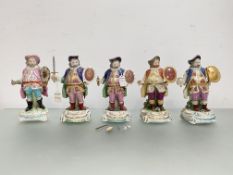 A group of porcelain figures of Falstaff: a Derby figure, in a blue coat, early 19th century; and