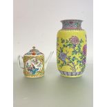 A Chinese famille rose vase with a yellow ground, probably 20th century, of cylindrical form, with