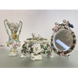 A group of floral-encrusted porcelain, 19th century, comprising: a Coalbrookdale style twin-