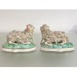A pair of 19th century Staffordshire models of recumbent sheep, in the manner of Samuel Alcock, each