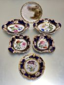 An English 19th century botanical partial dessert service, each piece painted with a floral spray