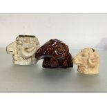A late 19th century bisque porcelain ram's head inkwell, with metal liner; together with a treacle-