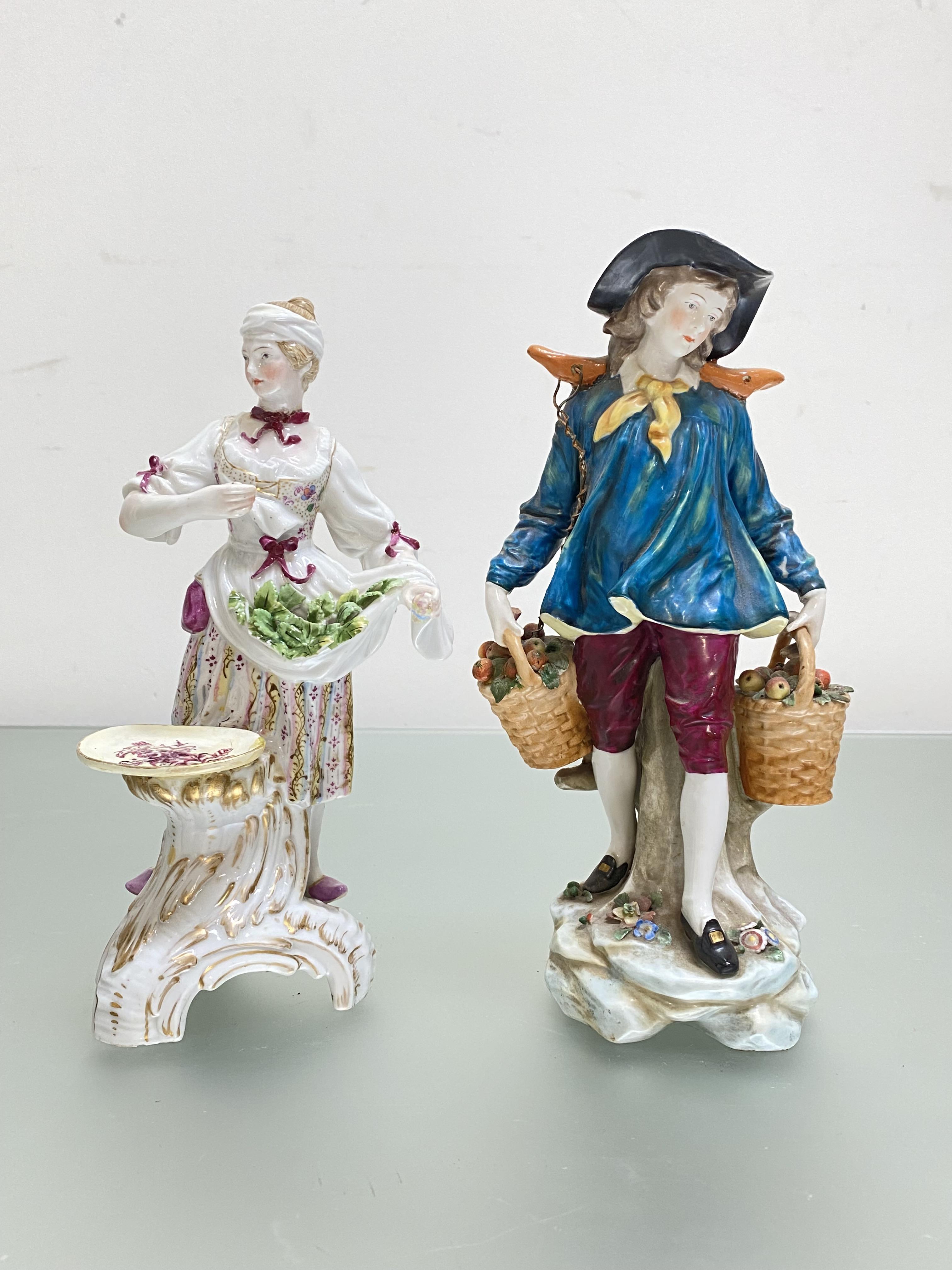 A Continental porcelain figure of a boy carrying baskets of fruit, 19th century, unmarked; and a
