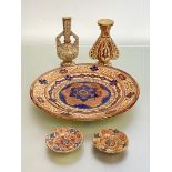 A group of copper lustre wares in the Hispano-Moresque taste, 20th century, comprising: a charger,