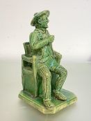 A rare Scottish green-glazed figure of Tam O'Shanter, third quarter of the 19th century, probably