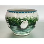 A Wemyss pottery Coombe jardiniere, painted with swans on a river by a reeded bank, impressed