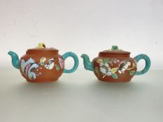 A pair of Chinese Yixing teapots, each of squat spherical form, with turquoise glazed bark handles