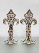 A pair of French faience vases each modelled as a fleur de lys, painted marks (a/f). 36.5cm