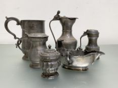 A group of 18th and 19th century pewter comprising: a twin-handled sauce boat, with scalloped rim; a