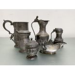 A group of 18th and 19th century pewter comprising: a twin-handled sauce boat, with scalloped rim; a