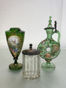 A group of Bohemian glass comprising: a green glass ring decanter, enamel painted with scrolling