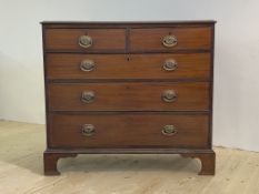 A George III mahogany chest, the moulded top over two short and three long graduated cockbeaded