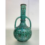 The Bombay School of Art Pottery: a twin-handled vase in the Persian taste, c. 1900, with foliate