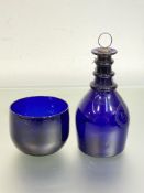 An early 19th century "Bristol" blue glass decanter, of mallet form, with triple ring neck, etched