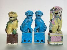 A pair of Chinese turquoise-glazed models of lion dogs, 20th century, each in characteristic pose