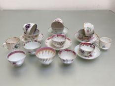 A collection of eleven English tea bowls, c. 1800, with five saucers, various factories including