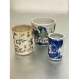 Two Chinese porcelain brush pots: the first blue and white, painted with figures on a bridge in a