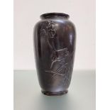 A Japanese bronze vase, Meiji period, c. 1900, decorated in relief with a kingfisher perched on a