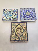 Two tiles of Iznik type, one painted with birds and baskets of fruit, the other a geometric