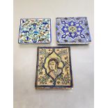 Two tiles of Iznik type, one painted with birds and baskets of fruit, the other a geometric