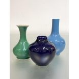 A group of three small Chinese porcelain vases comprising: a clair-de-lune monochrome glazed