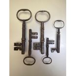 A bunch of five 18th/19th century iron keys, of varying sizes, each with oval loop handle. (5).