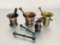 A group of four 18th and 19th century bronze mortars, of various shapes, together with five bronze