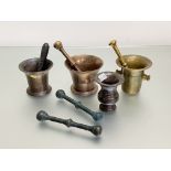 A group of four 18th and 19th century bronze mortars, of various shapes, together with five bronze