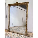 A large 19th cenutry gilt-framed overmantel mirror, the gesso, carved wood and composition frame