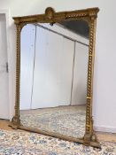 A large 19th cenutry gilt-framed overmantel mirror, the gesso, carved wood and composition frame