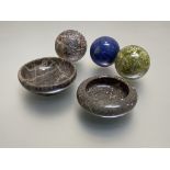 A group of three marble and hardstone spheres comprising: lapis lazuli, serpentine and a