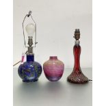 A group of studio and other glass comprising: a pink cased glass vase with blue inclusions; a blue