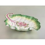 A Chelsea porcelain leaf-shaped dessert dish, c. 1760, naturalistically modelled and painted with