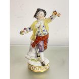 A late 19th century Meissen figure of a boy holding a floral garland, incised "F67" to the base,