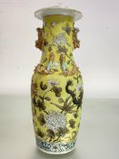 A Chinese famille jaune porcelain vase, 19th century, of shouldered baluster form, with kylin