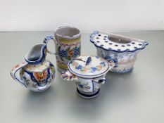 A group of French faience including Quimper comprising: a bough pot, decorated in blue and white