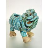 A Shiwan green-glazed pottery model of a three-legged toad. 17cm by 19.5cm