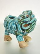 A Shiwan green-glazed pottery model of a three-legged toad. 17cm by 19.5cm