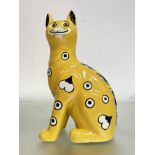 A Griselda Hill Pottery (Wemyss) model of a Galle style cat, glazed in yellow and with glass eyes,