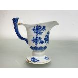 A Chinese Export blue and white porcelain jug of helmet shape, 18th century, decorated with floral