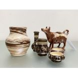 A late 19th century four piece agate ware pottery condiment set, indistinctly marked (possibly