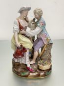 A 19th century Meissen porcelain figure group, modelled as a lady gardener with a boy a basket at