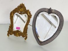 A late 19th century gilt-metal easel mirror in the Rococo taste, the shaped bevelled plate within