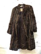 A fur coat labelled to interior Alexander Miller ? Edinburgh, measures 34cm across shoulders x