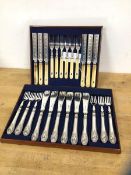 A set of six early 20thc bone handled fruit knives and forks, handles with animal head and another