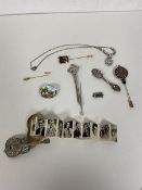 A mixed lot including silver bar brooches largest measures 9cm with celtic knot finial also a