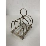 An 1898 Edinburgh silver toast rack likely Hamilton & Inches measures 9cm high and weighs 83grammes